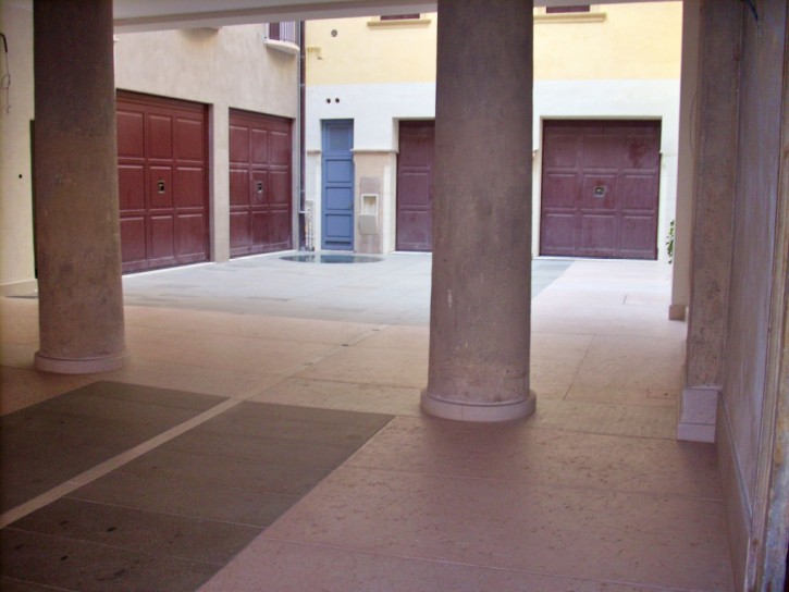 Protective and stain-resistant treatment on the stone flooring in the inner courtyard of a historic palace Protective and stain-resistant treatment on the stone flooring of a courtyard in a historic palace